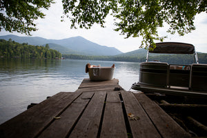 Pure Placid Bath Ritual Calm scents with tub on dock by the lake